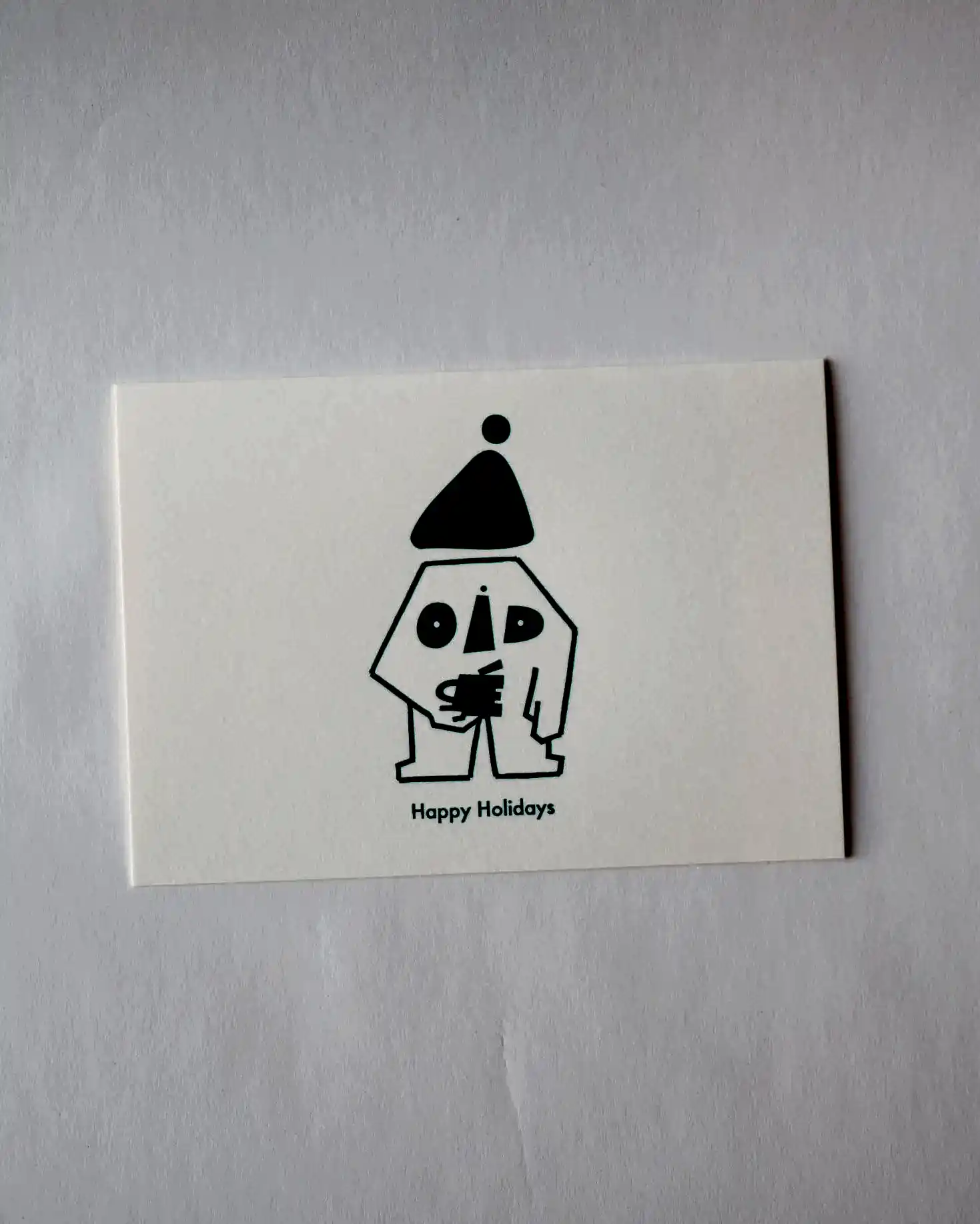 Small card with a green and white graphic and text on a white background